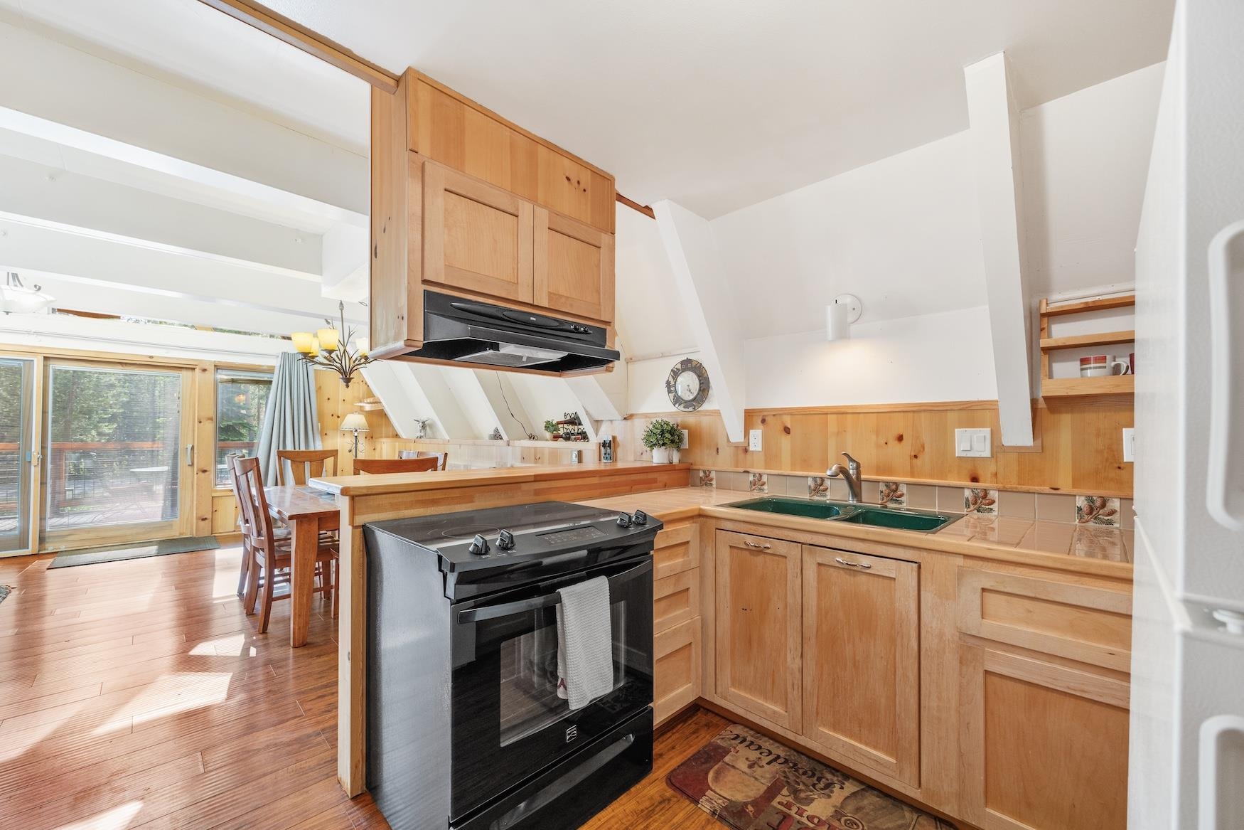 5262 Palisade Road Soda Springs, CA 95728 - Photo 8 of 24 a kitchen with stainless steel appliances a stove sink and cabinets