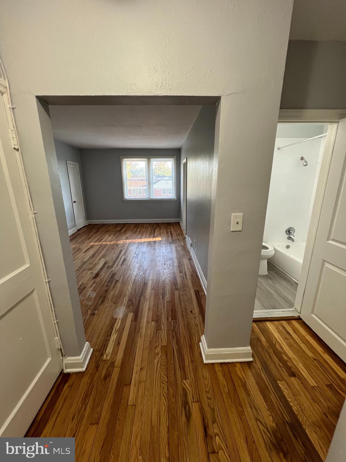 1100 Gleneagle Road Baltimore, MD 21239 - Photo 11 of 20 a view of a room with wooden floor and staircase