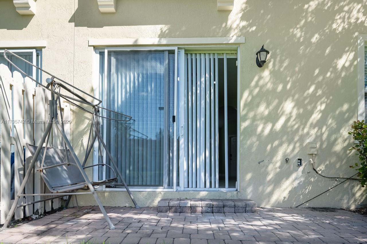 2851 Prospect Road, Unit 1208 Tamarac, FL 33309 - Photo 19 of 34 a view of a house with backyard and wooden fence