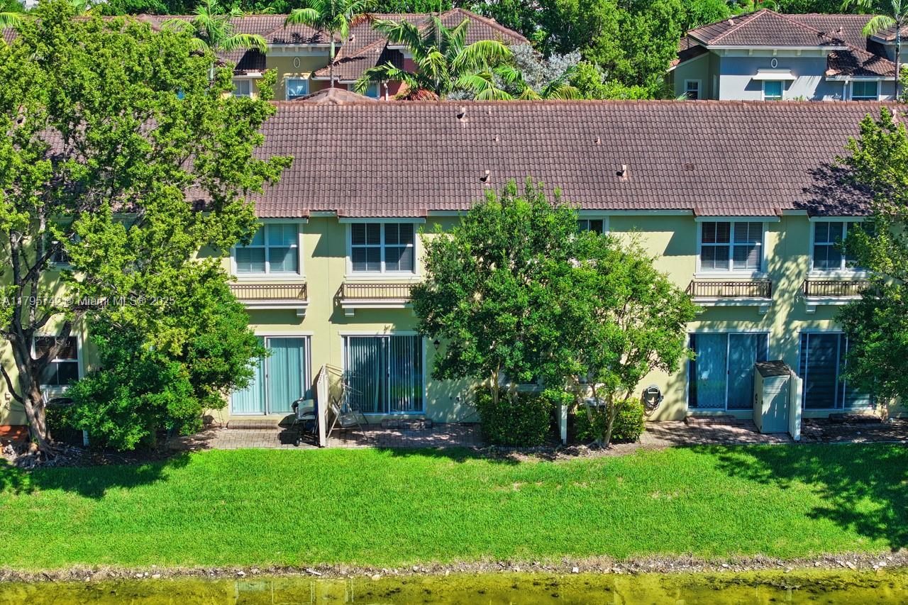 2851 Prospect Road, Unit 1208 Tamarac, FL 33309 - Photo 20 of 34 front view of a house with a yard