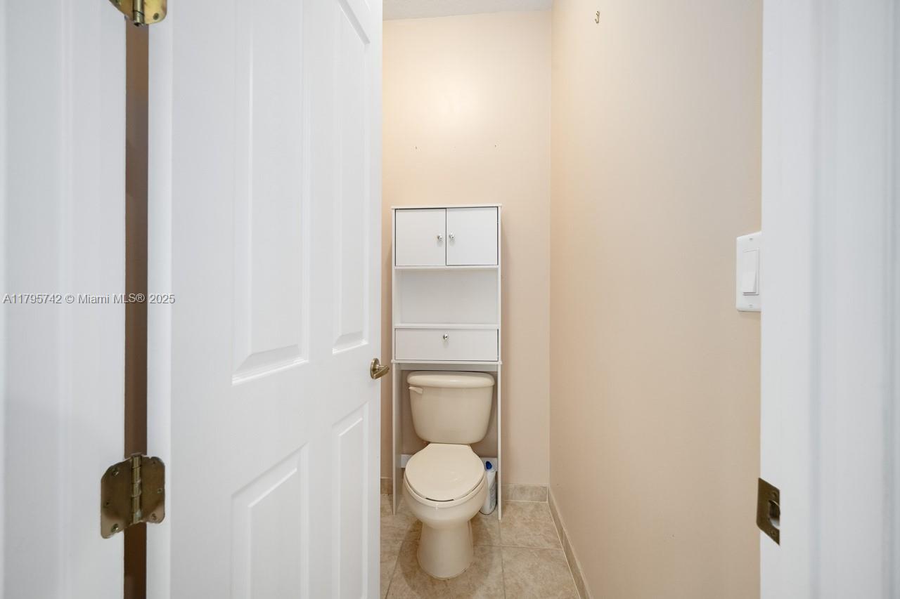 2851 Prospect Road, Unit 1208 Tamarac, FL 33309 - Photo 33 of 34 a bathroom with a toilet