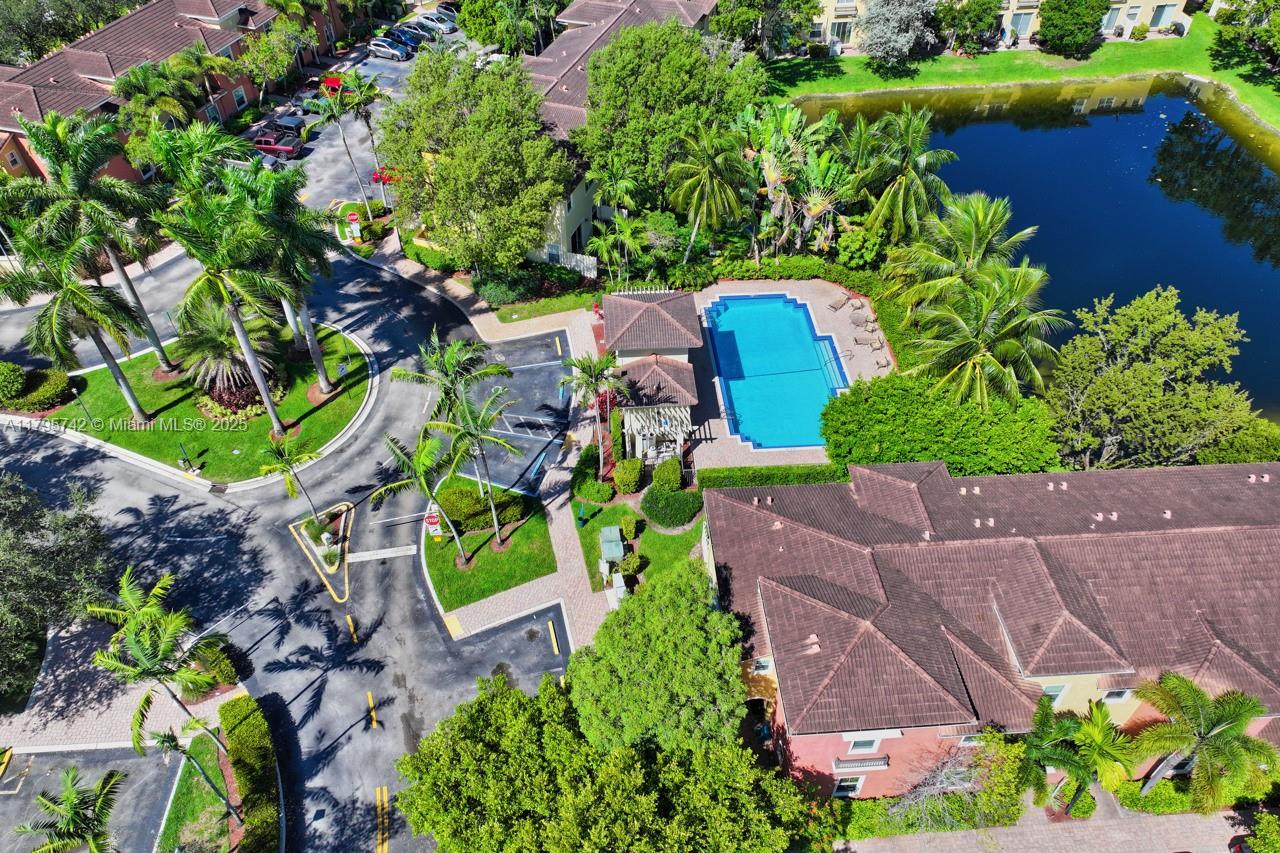 2851 Prospect Road, Unit 1208 Tamarac, FL 33309 - Photo 4 of 34 an aerial view of a house with a yard and a large pool