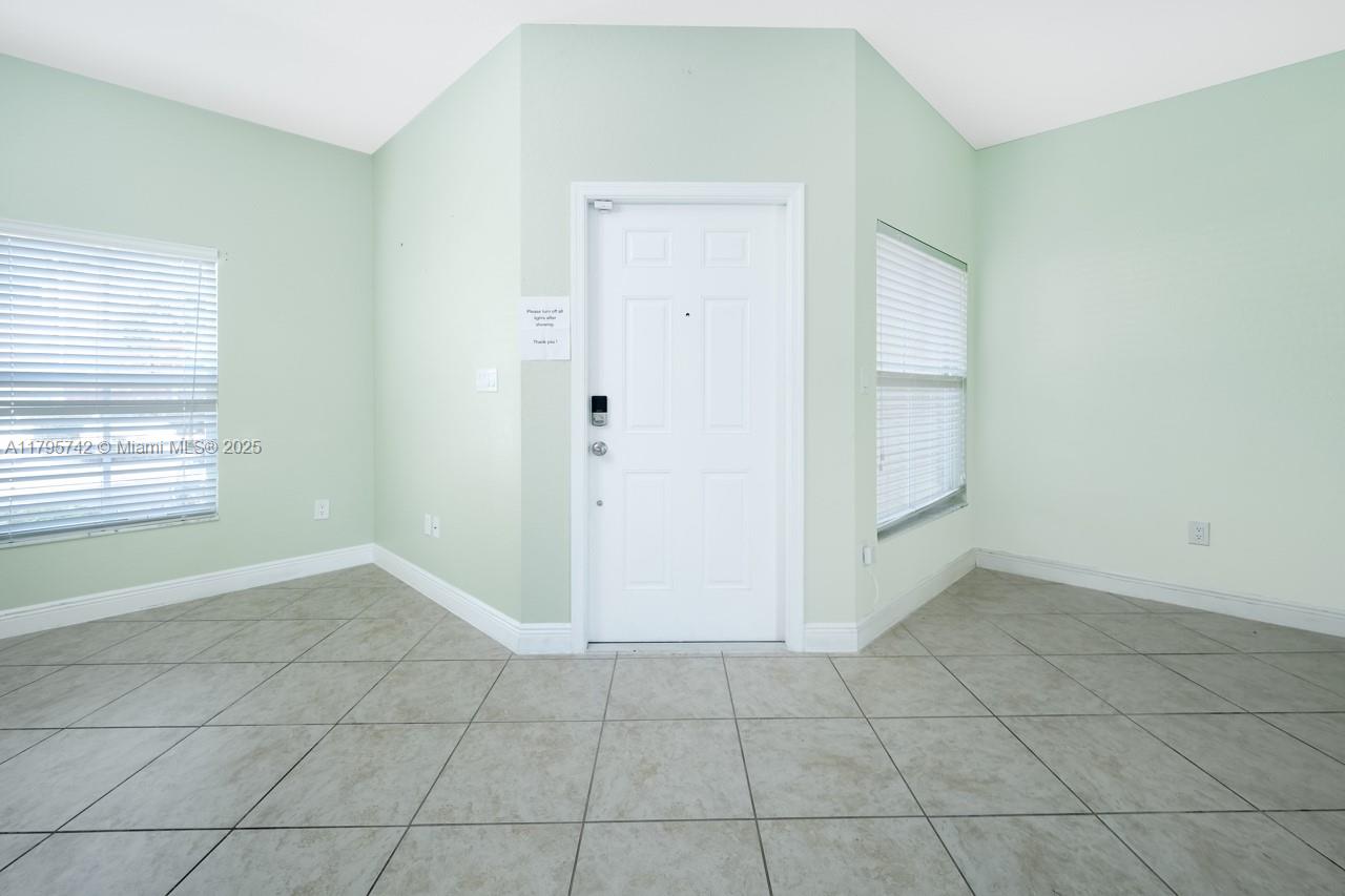 2851 Prospect Road, Unit 1208 Tamarac, FL 33309 - Photo 6 of 34 an empty room with windows