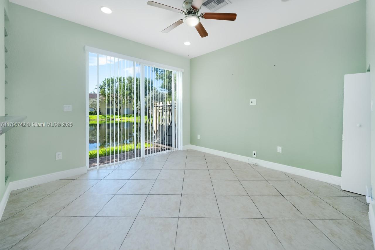 2851 Prospect Road, Unit 1208 Tamarac, FL 33309 - Photo 8 of 34 a view of an empty room with a window