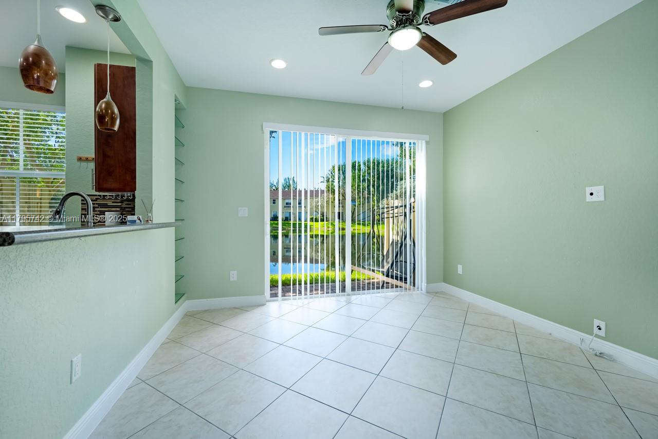 2851 Prospect Road, Unit 1208 Tamarac, FL 33309 - Photo 9 of 34 a view of an empty room with a window