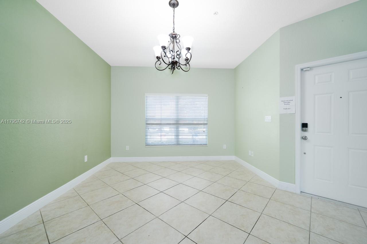 2851 Prospect Road, Unit 1208 Tamarac, FL 33309 - Photo 10 of 34 a view of an empty room with window
