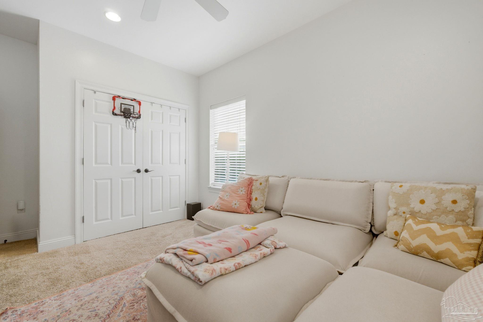 5931 Otter Point Road Pensacola, FL 32504 - Photo 31 of 67 a living room with furniture and a couch