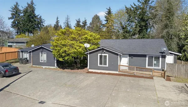 an aerial view of residential houses with outdoor space