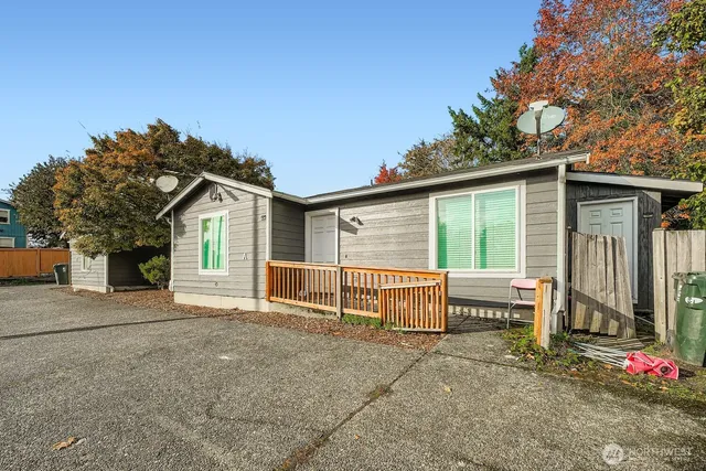 a view of a house with wooden fence