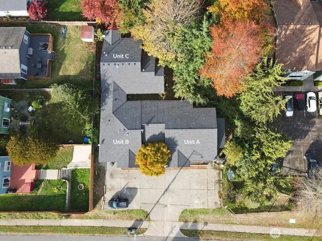 an aerial view of residential houses with outdoor space