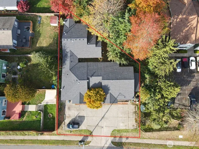 an aerial view of residential houses with outdoor space
