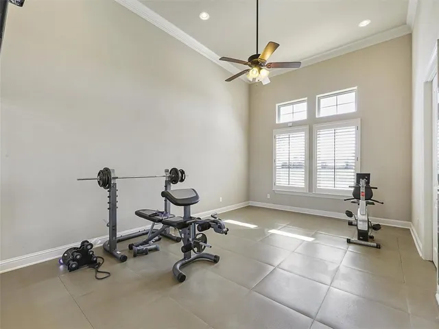 a view of a workspace with a window and gym equipment