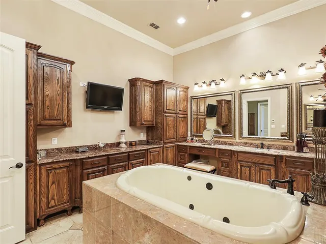 a large white kitchen with a large window