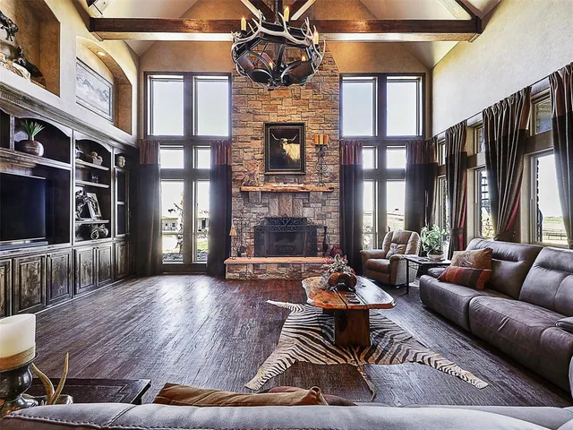 a living room with furniture fireplace and flat screen tv