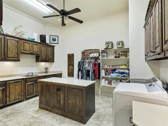 a kitchen with stainless steel appliances granite countertop a sink and cabinets