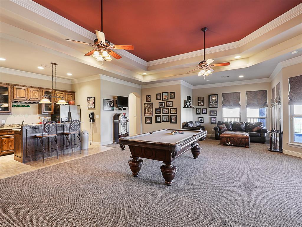 1200 McReynolds Road Sanger, TX 76266 - Photo 25 of 40 a living room with furniture and a chandelier
