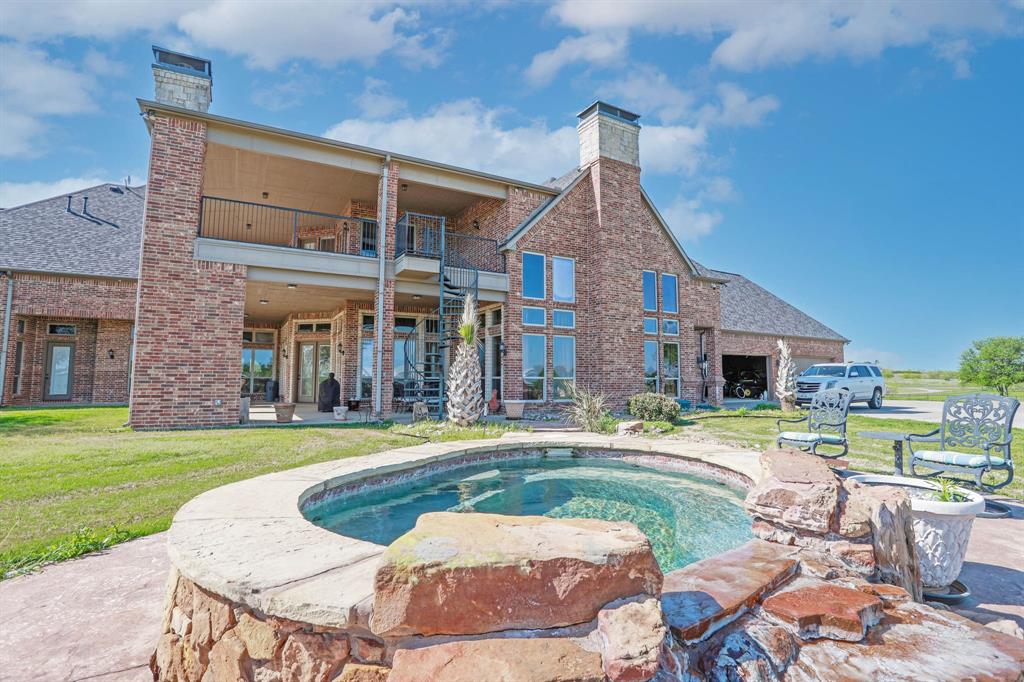 1200 McReynolds Road Sanger, TX 76266 - Photo 29 of 40 a view of a house with swimming pool and a yard