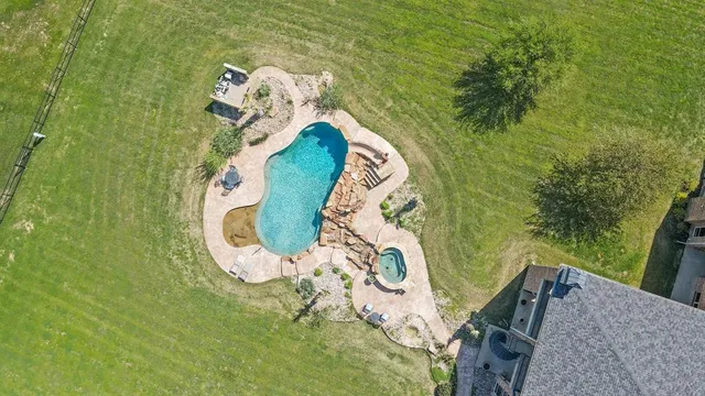 a view of swimming pool with outdoor seating