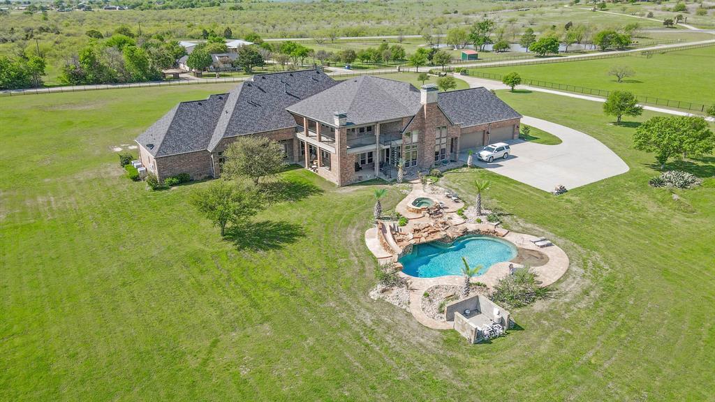 1200 McReynolds Road Sanger, TX 76266 - Photo 34 of 40 an aerial view of a house with a garden and lake view