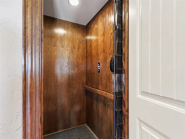 a bathroom with a mirror and a shower