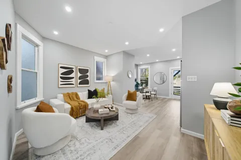 a living room with furniture and a rug