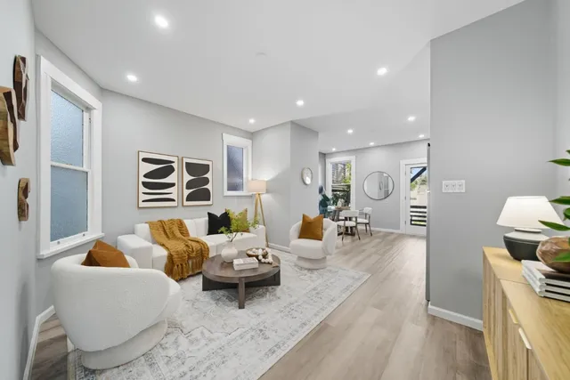 a living room with furniture and a rug
