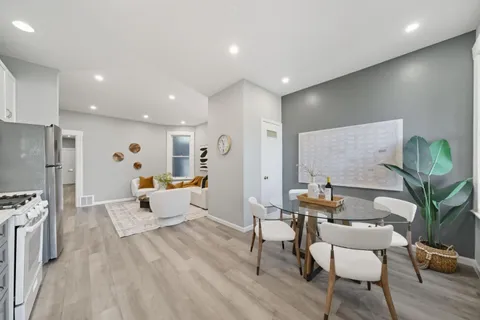 a kitchen with stainless steel appliances kitchen island granite countertop a sink and cabinets
