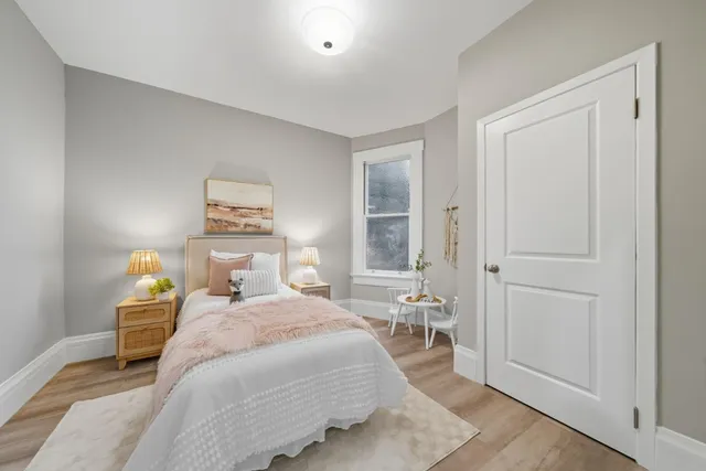 a bedroom with a bed and a table