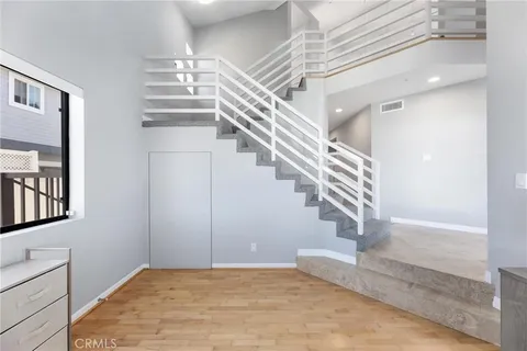 a view of entryway and hall with a front door
