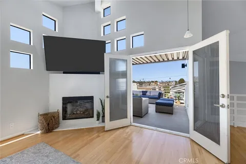 a view of living room with furniture and a fireplace