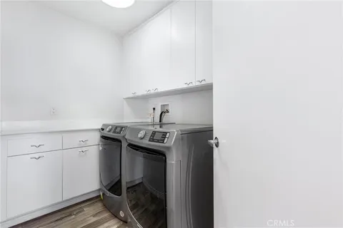 a utility room with cabinets