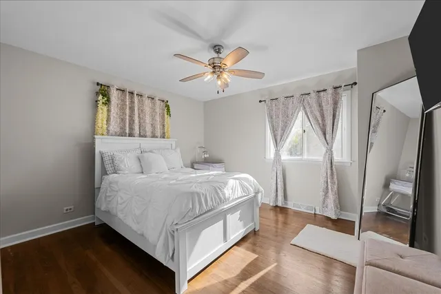 a bed room with a bed and a window