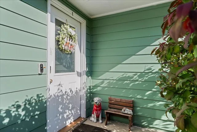 a bench is sitting in front of a window