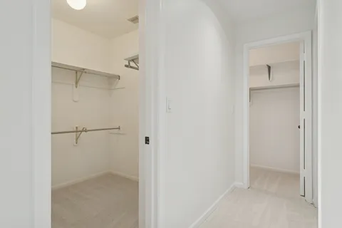 a bathroom with a granite countertop shower mirror and a sink