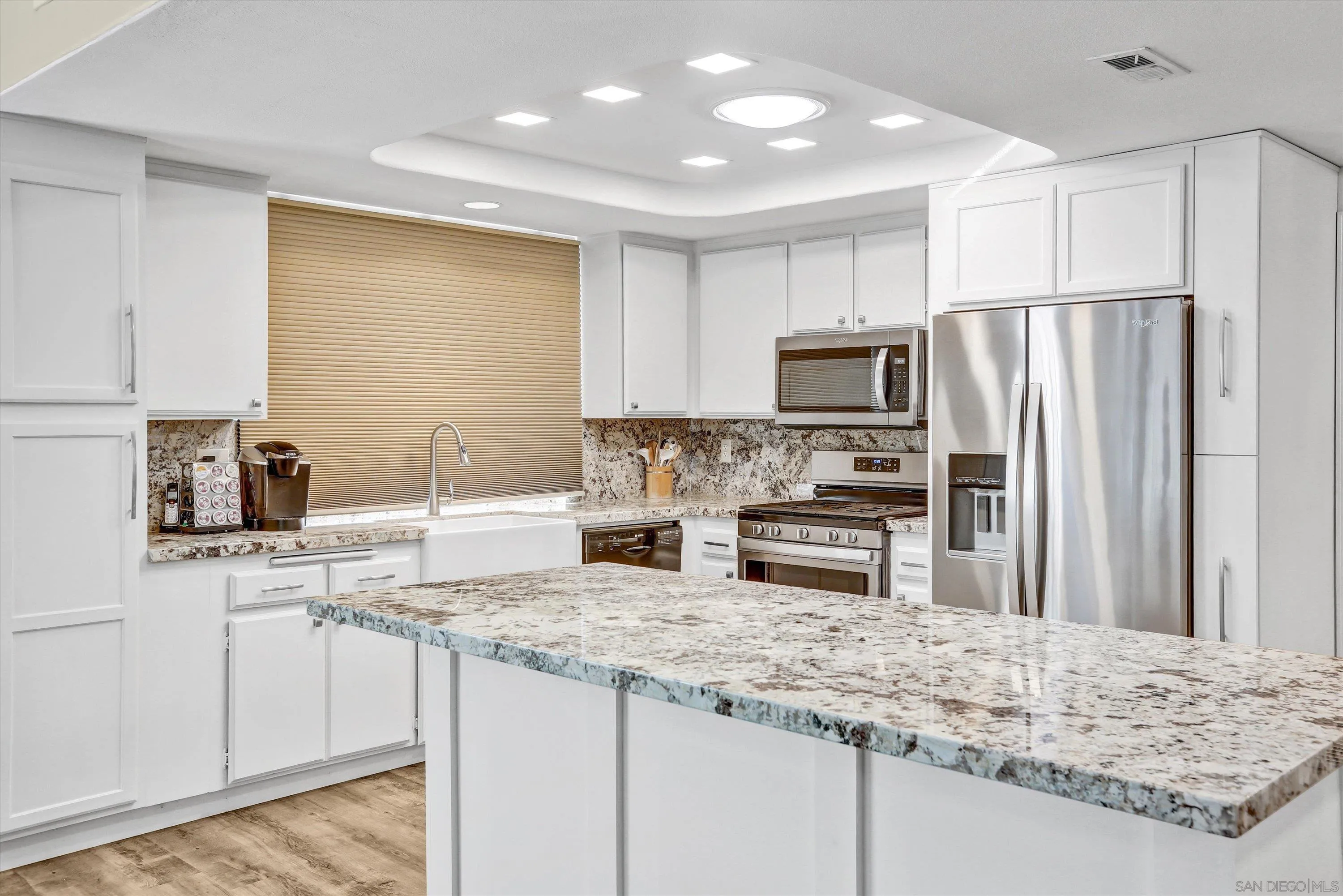9448 Palomino Ridge Drive Lakeside, CA 92040 - Photo 11 of 35 a kitchen with stainless steel appliances granite countertop a sink stove and refrigerator