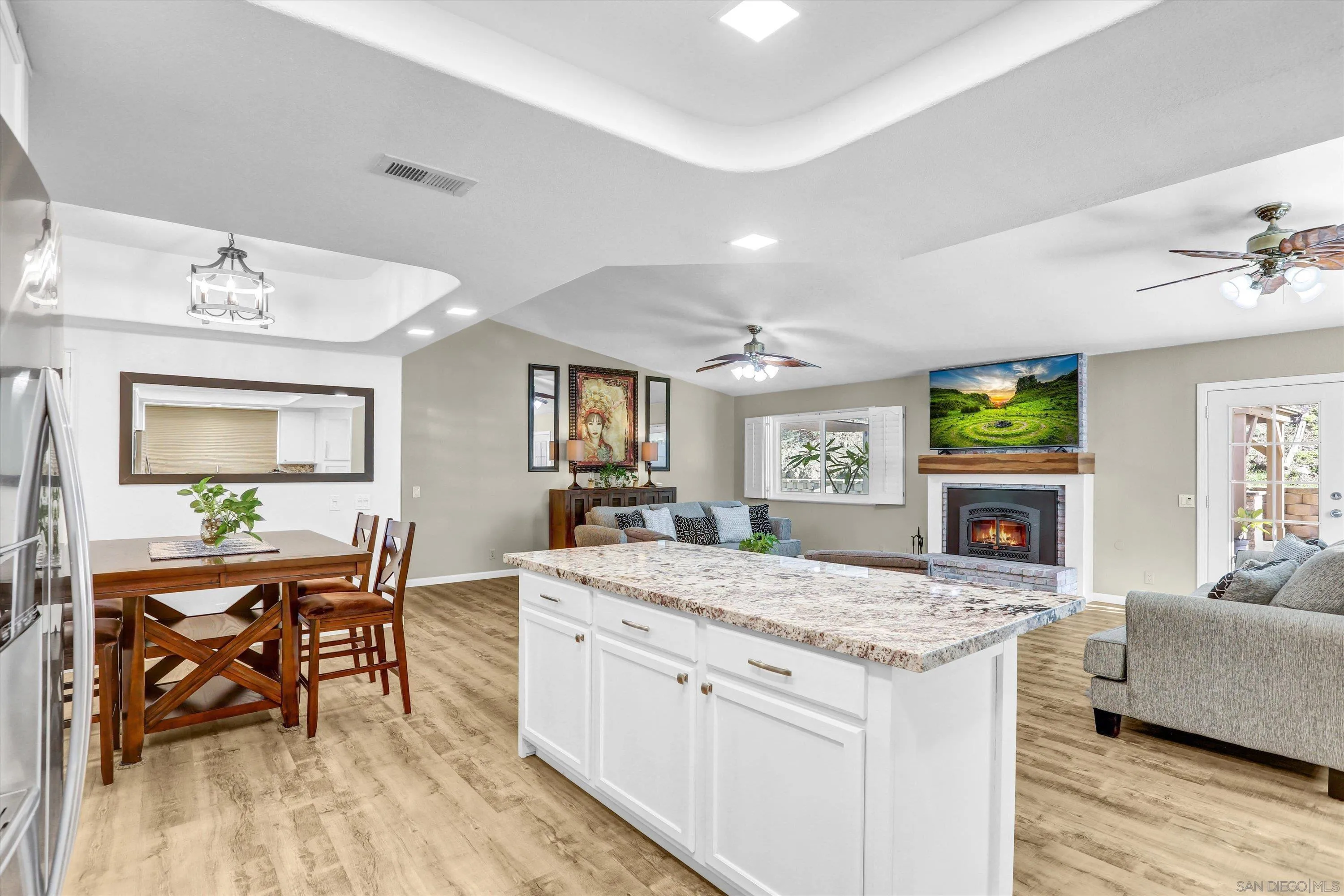 9448 Palomino Ridge Drive Lakeside, CA 92040 - Photo 13 of 35 a view of living room with granite countertop furniture and fireplace