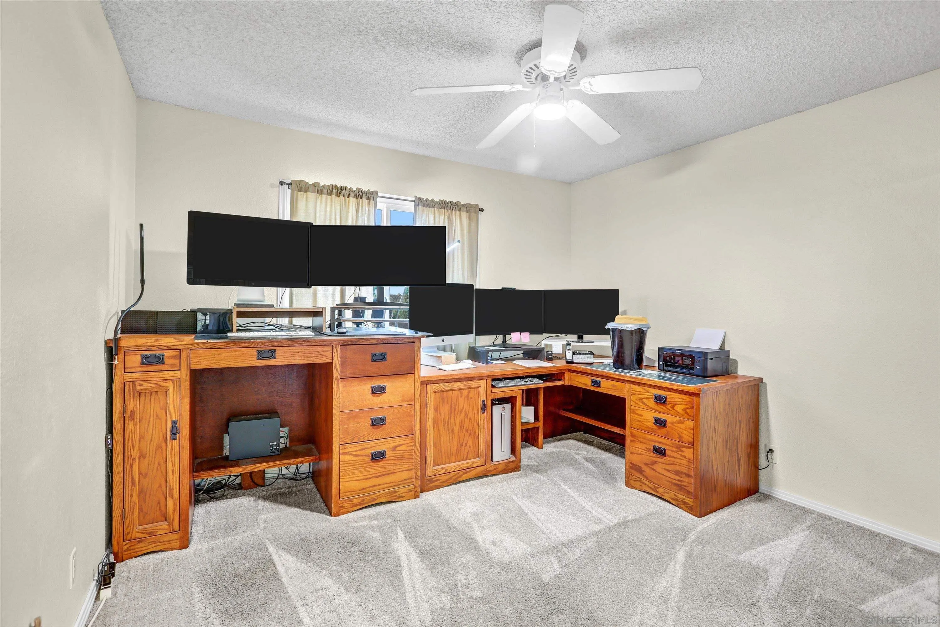 9448 Palomino Ridge Drive Lakeside, CA 92040 - Photo 19 of 35 a bed room with a bed and a computer