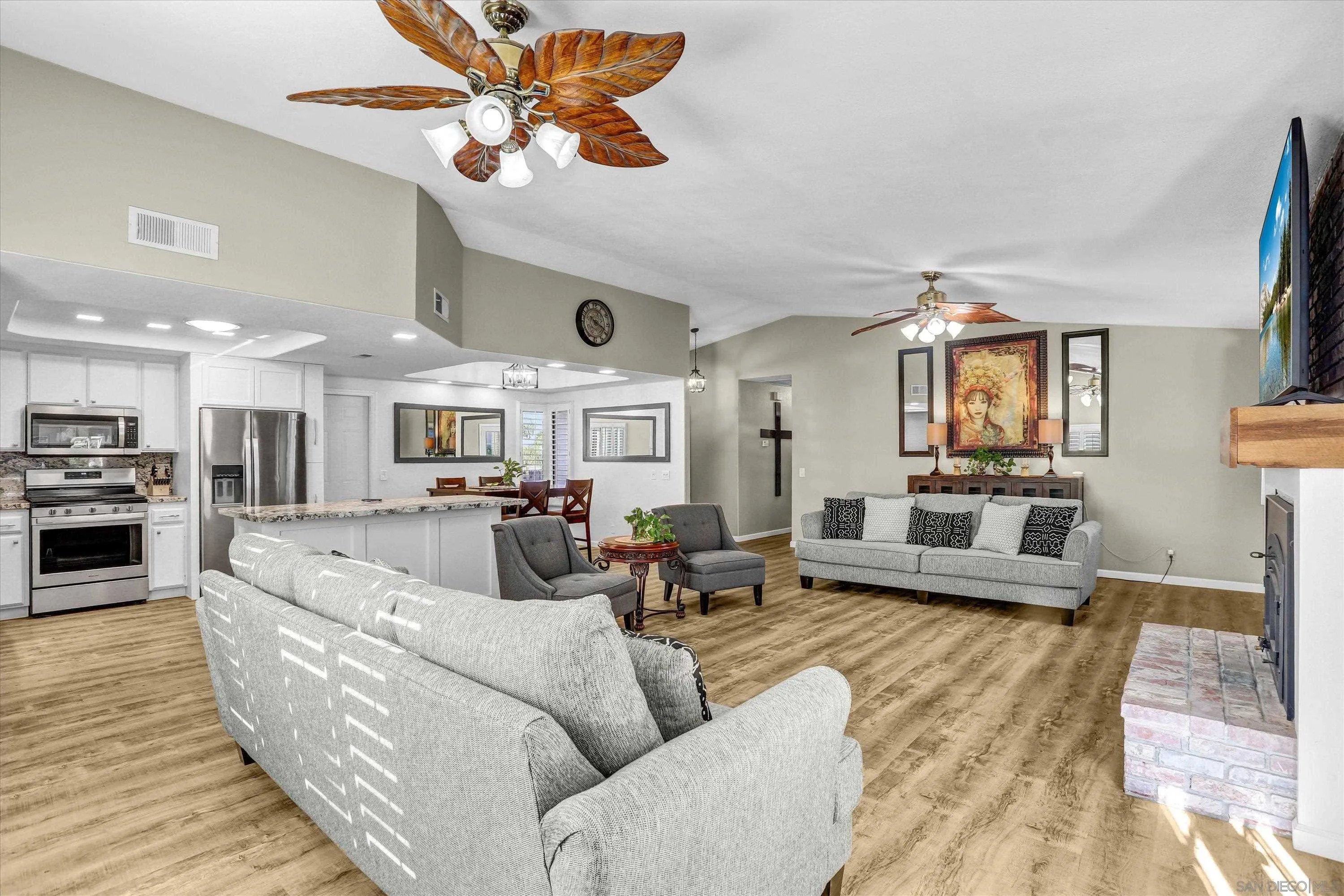 9448 Palomino Ridge Drive Lakeside, CA 92040 - Photo 7 of 35 a living room with furniture kitchen view and a wooden floor