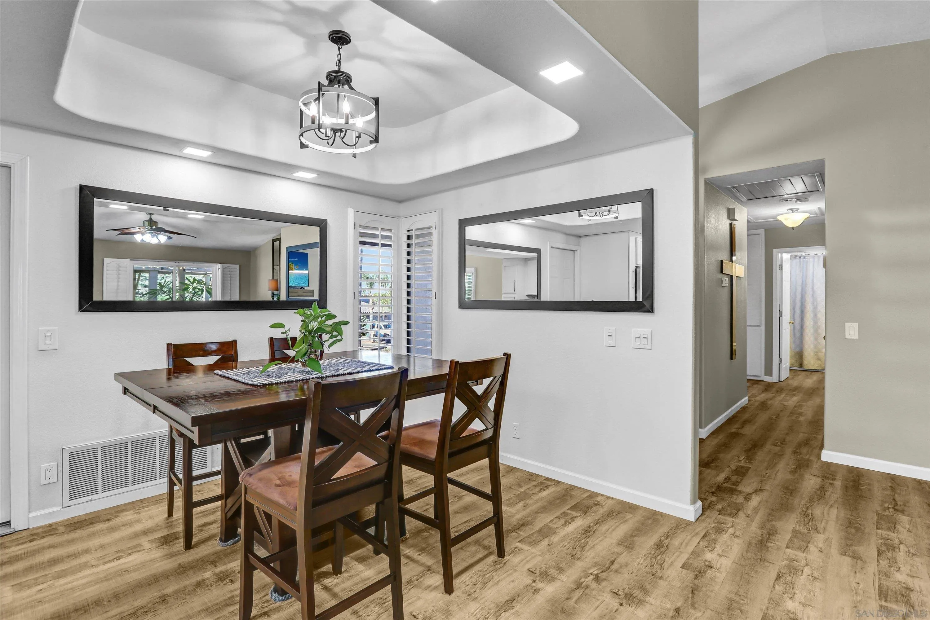 9448 Palomino Ridge Drive Lakeside, CA 92040 - Photo 9 of 35 a view of a dining room with furniture and chandelier