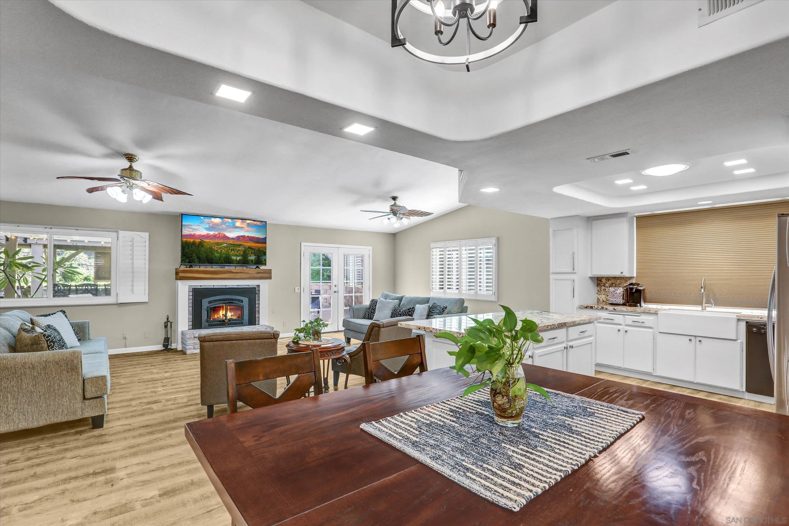 9448 Palomino Ridge Drive Lakeside, CA 92040 - Photo 10 of 35 a living room with furniture a fireplace and a flat screen tv