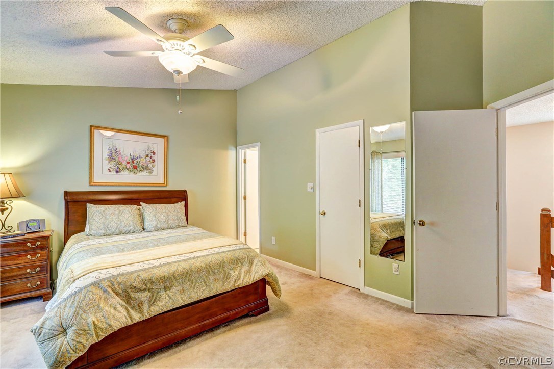 14117 Ridge Creek Road Midlothian, VA 23112 - Photo 11 of 24 a bedroom with a bed and a chandelier