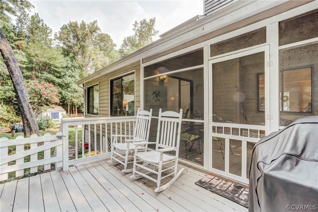 14117 Ridge Creek Road Midlothian, VA 23112 - Photo 18 of 24 a view of a chair and table on the deck