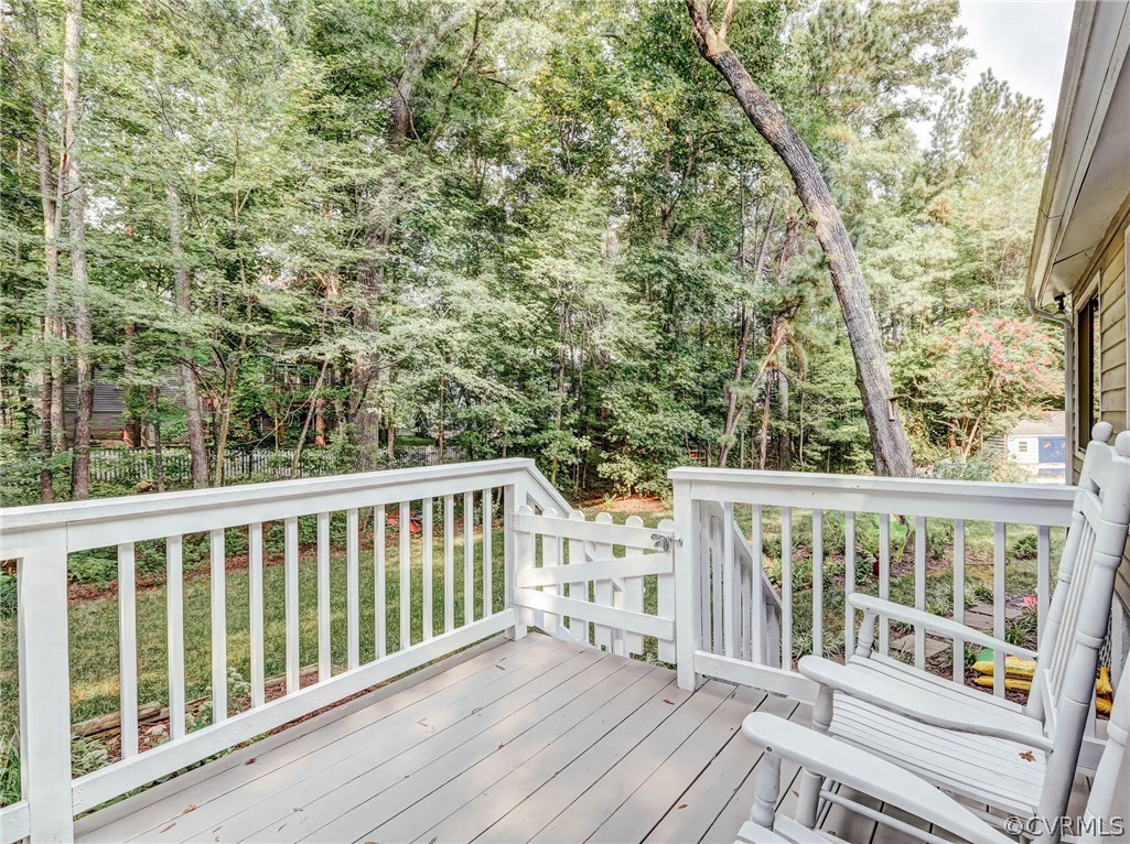 14117 Ridge Creek Road Midlothian, VA 23112 - Photo 19 of 24 a view of roof deck with wooden floor and fence