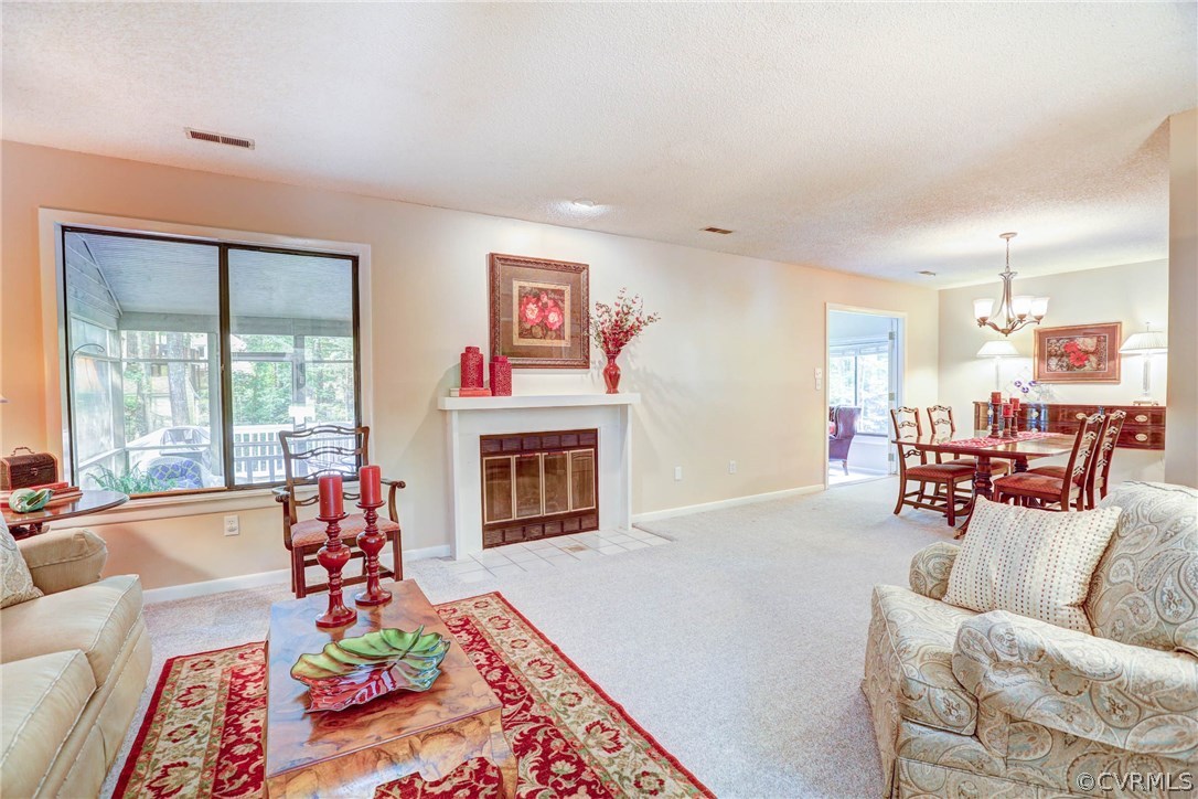 14117 Ridge Creek Road Midlothian, VA 23112 - Photo 4 of 24 a living room with furniture or couch and a fireplace