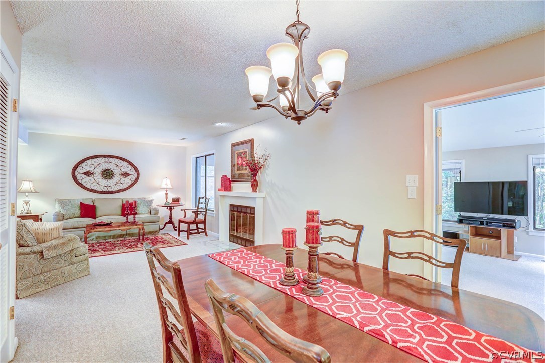 14117 Ridge Creek Road Midlothian, VA 23112 - Photo 6 of 24 a living room with fireplace furniture and a flat screen tv