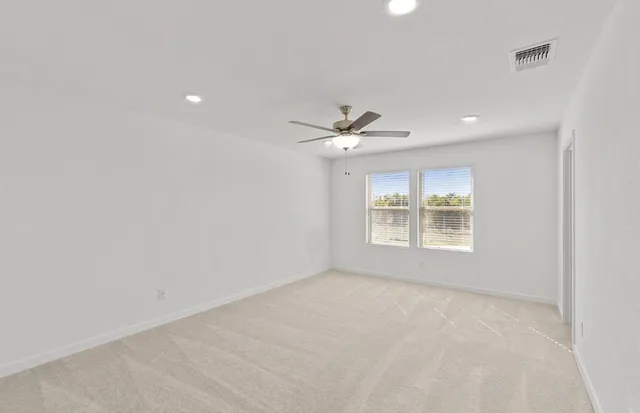 a kitchen with stainless steel appliances kitchen island sink refrigerator and cabinets