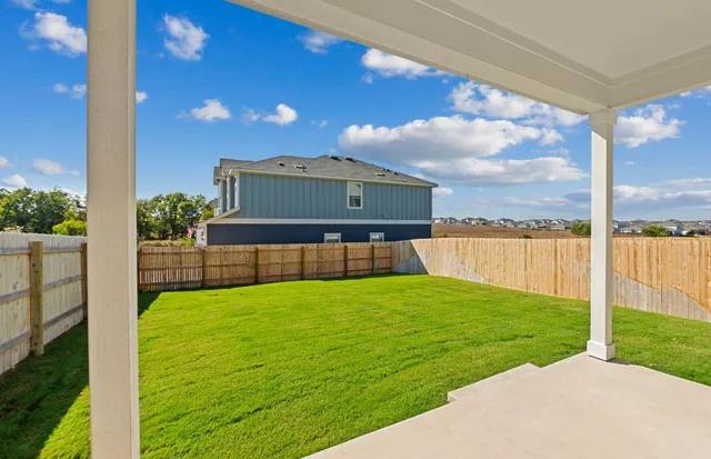 a view of a backyard with a garden