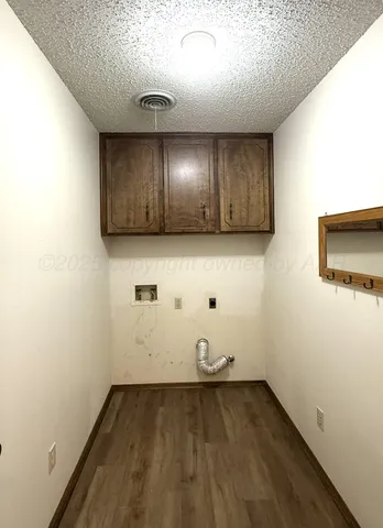 a view of room with wooden floor