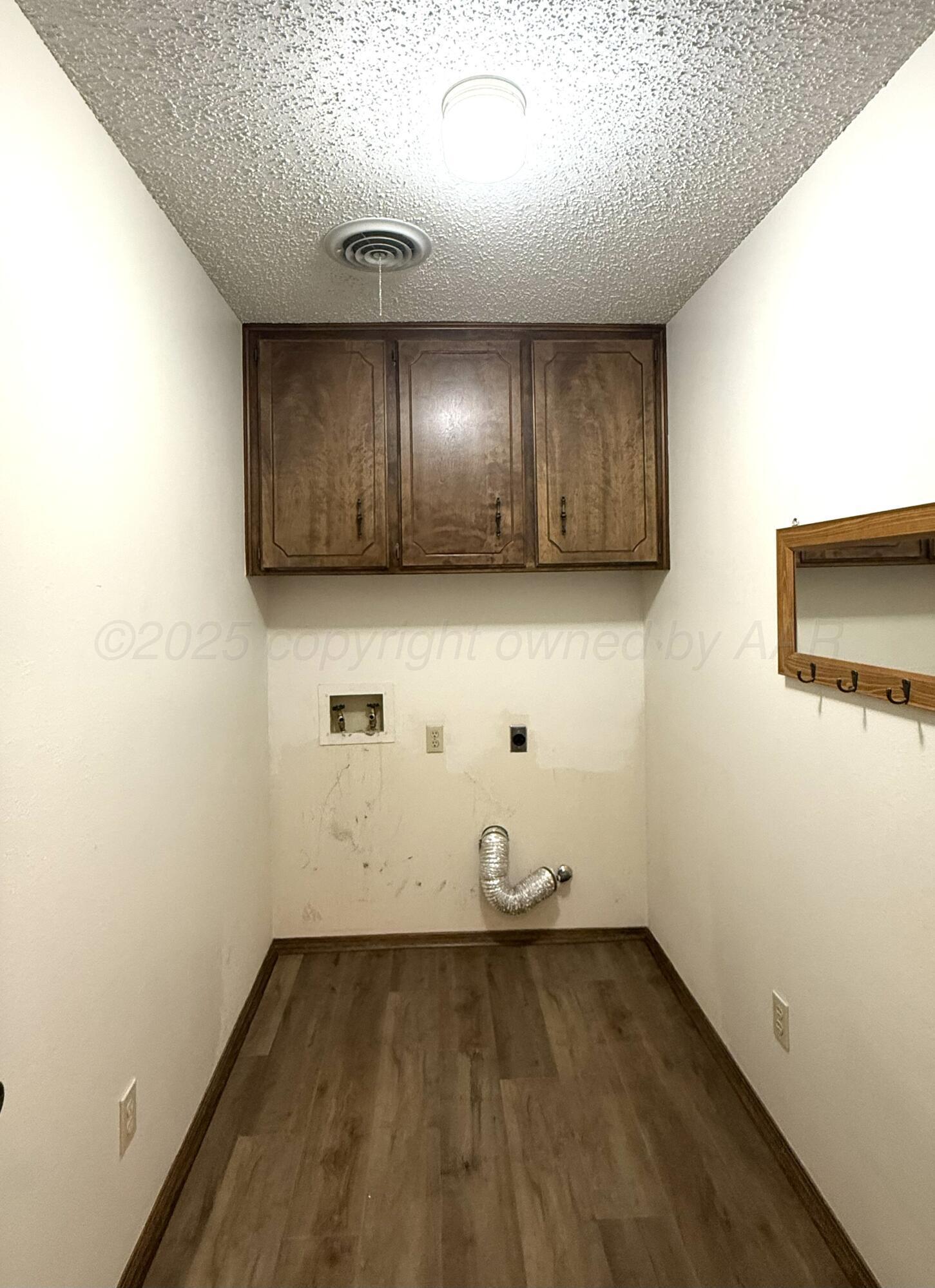 1525 North Nelson Street Pampa, TX 79065 - Photo 12 of 15 a view of room with wooden floor