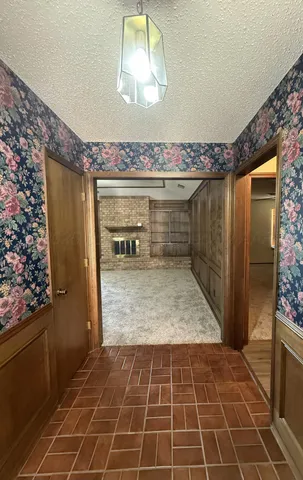 a bathroom with a glass door shower and a sink